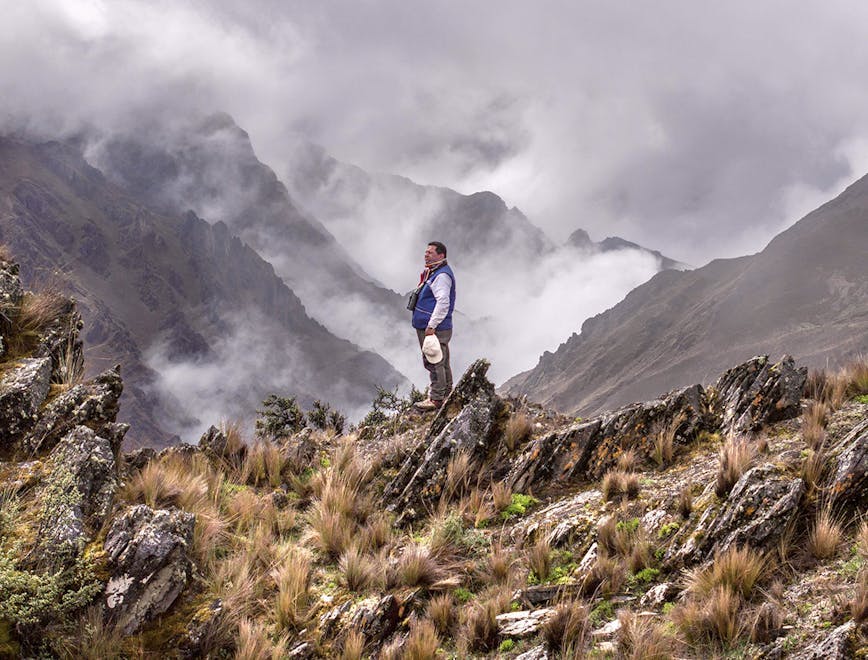 hiking nature outdoors person wilderness mountain range peak slope scenery walking